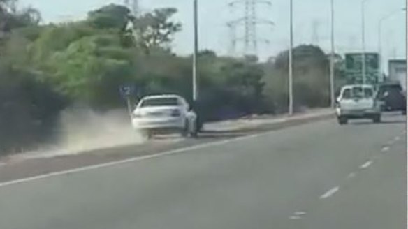 Perth road warning: Kwinana Freeway driver's lucky escape caught on camera