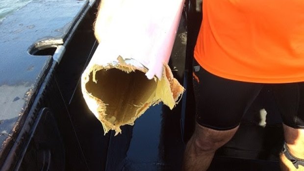 The Maroochydore man with his damaged kayak following the shark attack.