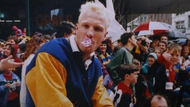Former Eagle Karl Langdon with a baby's dummy during the 1992 Grand Final Parade.