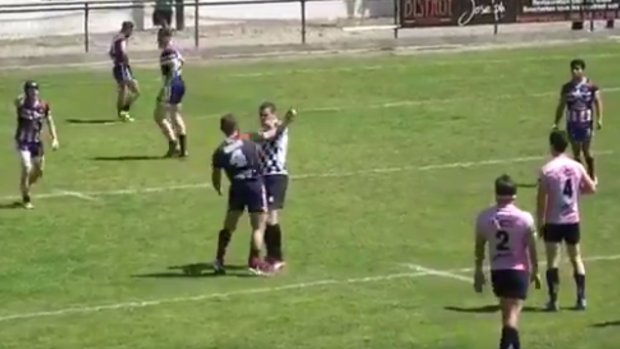 Sickening moment: Referee Benjamin Casty sends a player off moments before he is knocked out.