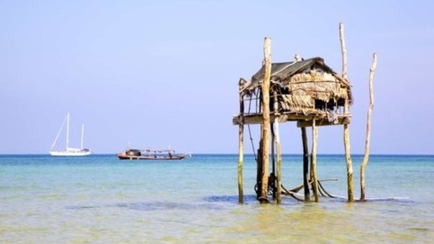 Moken hut and tour boat, Mergui Islands, Myanmar.