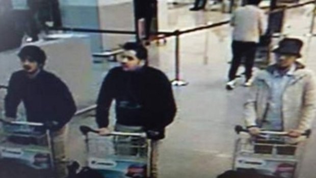 Nam Laachraoui, left captured on CCTV, moments before the blast with two other bombers. 