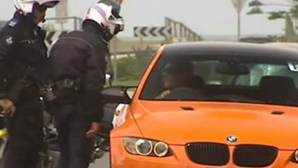 Bad boy: Bernard Tomic is pulled over by police.