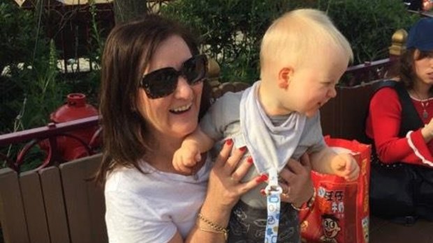 Preston woman Kerri Cosma, pictured here with her grandson Harrison while on holiday in China, is fighting for her life after contracting swine flu.