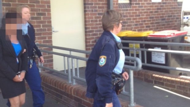Police lead Betty Colt from Moss Vale Court as she is sentenced on Monday.