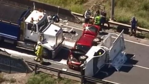 A person became trapped when a truck rolled on the Gateway Motorway at Bald Hills.