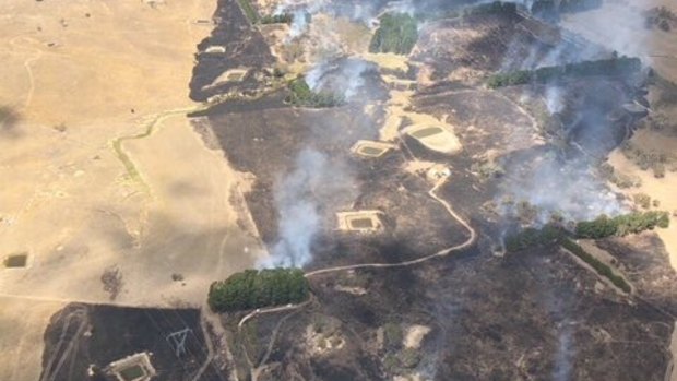 Burnt out land near Tarago, caused by an out of control bushfire.