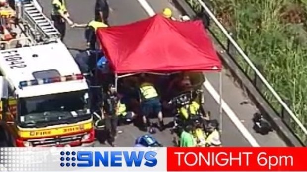 Emergencey workers at the scene of a fatal motorcyle crash on Bruce Highway.