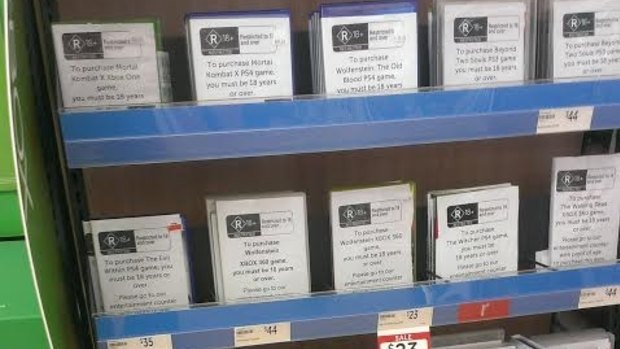 Games including <i>Beyond: Two Souls</i>, <i>The Witcher 3</i> and <i>Mortal Kombat X</i> are displayed with plain packaging at a South Australian Target.