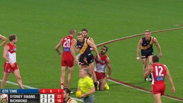 Adam Goodes and Tiger Taylor Hunt clash at quarter-time.