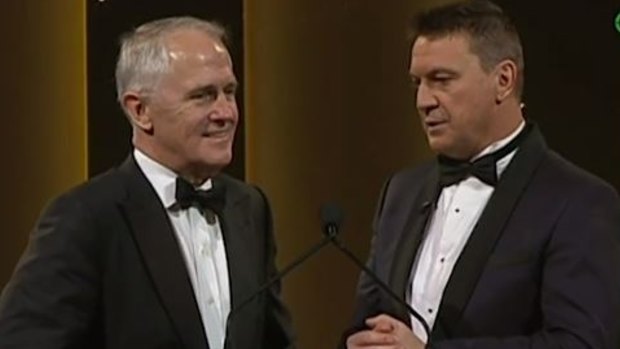 PM Malcolm Turnbull and Tony Squires ride out an awkward moment at the Dally M awards.