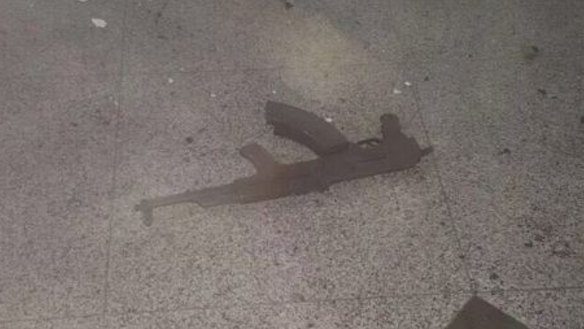 An assault weapon on the floor after the attack.