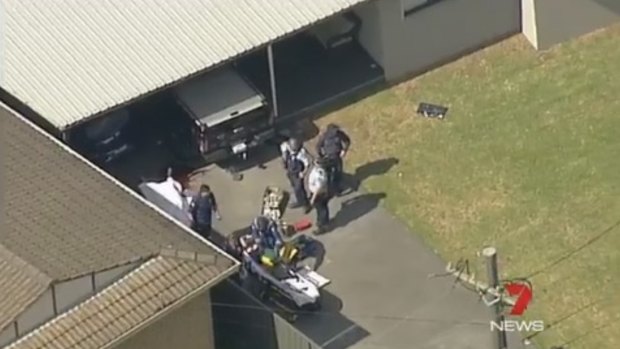 Aerial footage from the scene showed the body covered by a white sheet in the driveway. 