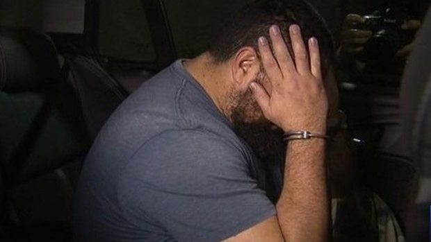 Omar Succarieh arrives at the Brisbane Watchhouse following his arrest in September 2015.