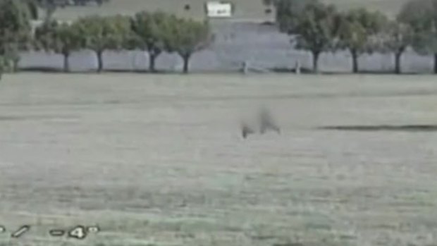The two men could be seen running across the field next to the prison.