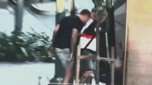 The two men are alleged to have attacked the driver at Surfers Paradise.