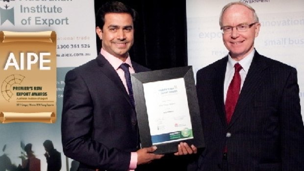 AIPE chief executive Amjad Khanche accepting an award from the NSW government.