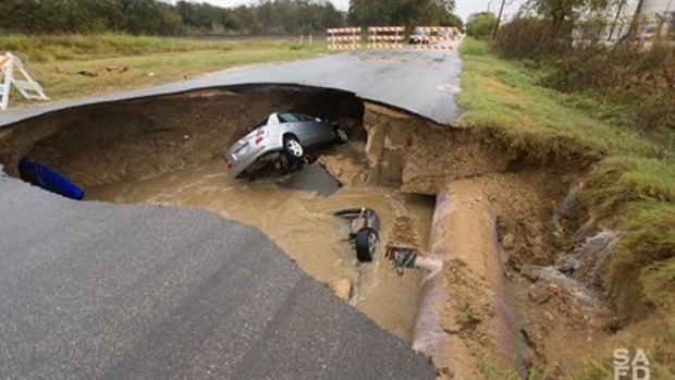 The sinkhole swallowed two cars. 
