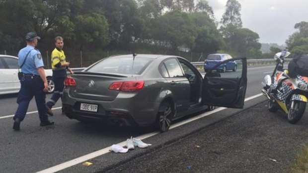 The allegedly stolen car travelled into Queensland on just its wheel rims after road spikes wee laid, police said.