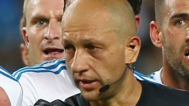Ref drama: Melbourne Victory players argue with referee Strebre Delovski during the round 17 match against Sydney FC.
