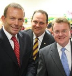 Scott Driscoll, pictured with Tony Abbott and Bruce Billson in an image from the Queensland Retail Traders and Shopkeepers Association website, was eager to advance his own political career.  