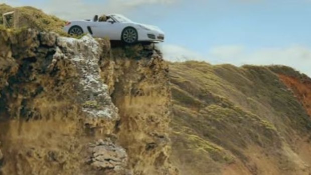 Ultra Tune Australia ad depicts two women in a car which goes off the cliff after being put in the wrong gear.