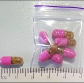 The drug is being sold in Canberra in pink and clear capsules, containing brown granular material.