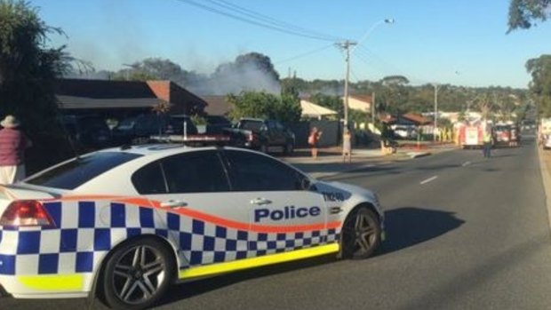 Police have closed sections of Beach Road due to a house fire. 