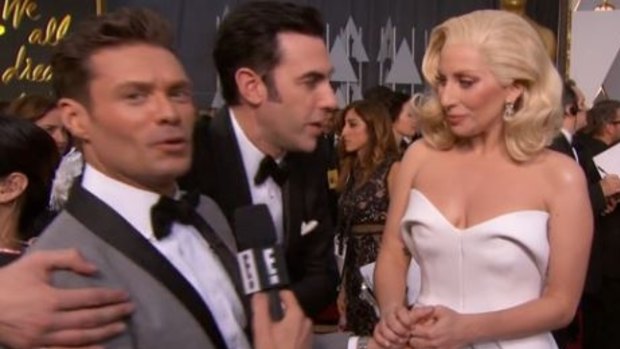 Oscars red carpet: Ryan Seacrest tries to snub Sacha Baron Cohen on Oscars 2016 red carpet. The Brit hugs him anyway during his interview with Lady Gaga.