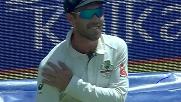 Glenn Maxwell clutches his shoulder in a mock reference to Virat Kohli's injury.