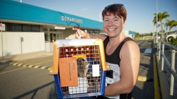 Pet store worker Kelly Jones with Coco before the scheduled flight home.