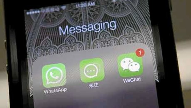 The Laiwang app of Alibaba Group (centre) and WeChat of Tencent Group compete with Western apps.