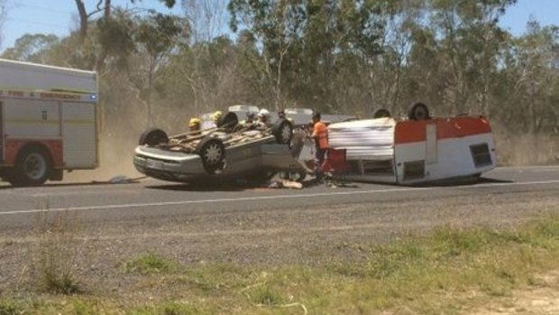 A car and caravan rolled on the Isis Highway, near Childers, on Monday.