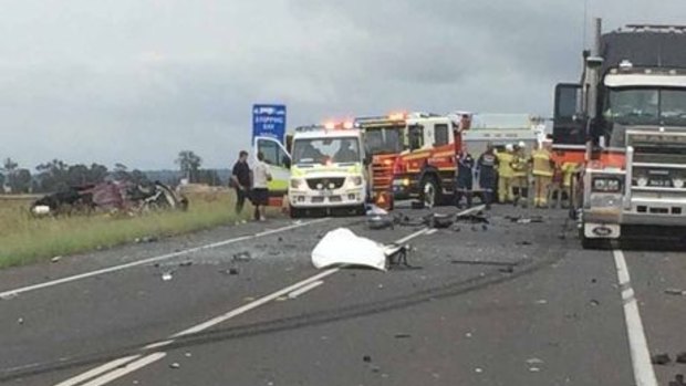 Emergency crews at the scene of a fatal crash on the Warrego Highway at Oakey on Thursday.