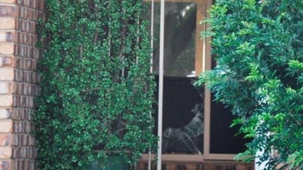 The damage caused when a man armed with a garden fork smashed a home's glass door and demanded the keys to a couple's utility.