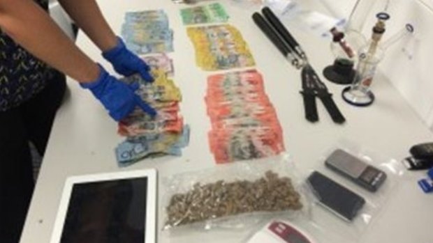Police have seized cash, drugs and weapons, including nunchuckus and knives, from a Varsity Lakes home.