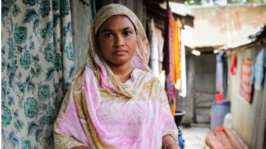 Garment worker Anju, who sews jumpers for 37 cents an hour in a factory in Bangladesh.