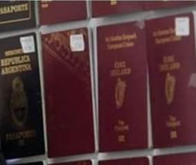 Some of the fake passports displayed by Thai police.