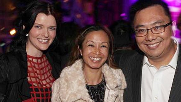 Amber Harrison, left, with former boss Nick Chan and his wife Peggy.