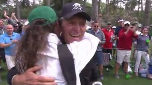 Loving life: Gary Player hugs his grandaughter Alex after the ace.