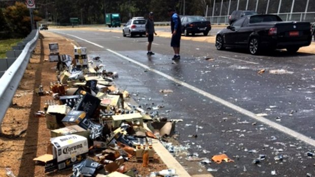 D'oh! Beer meant for a wedding spilled over Cotter Road on Friday.
