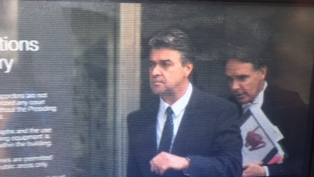 Former police officer Guy Felton leaves court after being sentenced for family violence against his ex-wife and son.