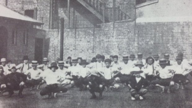 Boys exercising in the yard of the Metropolitan Boys' Shelter, part of the Albion Street Children's Court, in 1913.