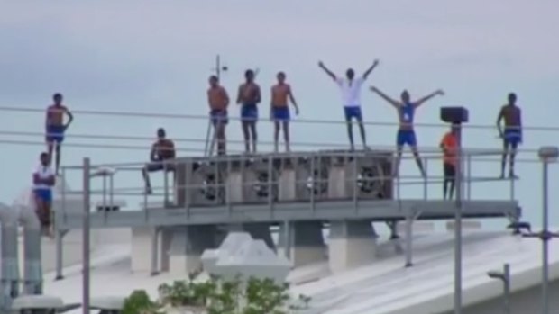 The rioting youths stayed on the roof of the centre overnight.