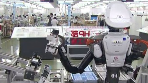 Robots in the workplace at Glory Ltd in Japan.