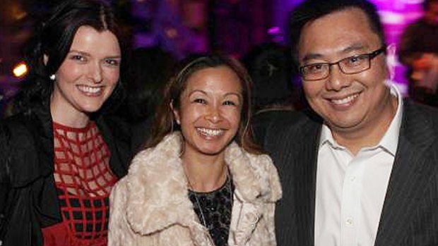 Amber Harrison (left), with her boss Nick Chan and his wife Peggy. Chan was responsible for approving Harrison's $500,000 in expenses over five years.