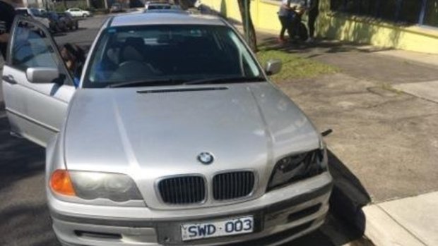 Police say a man in the silver BMW is involved in a theft at gunpoint in Bentleigh. 