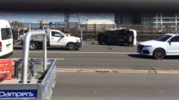 Traffic was brought to a standstill when a car rolled over on the Sydney Harbour Bridge.