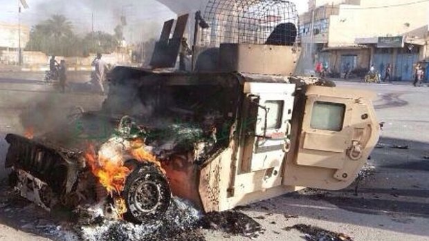 An Iraqi military vehicle burns after an attack by Islamic State militants in Anbar province last weekend.