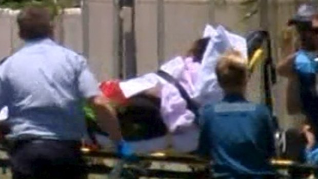 The mother of the children slain in Cairns, who was taken from the crime scene on a stretcher, has been arrested over the deaths.